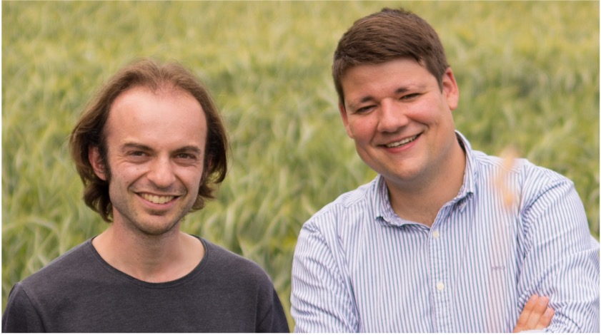 Terensis founders in front of a cereal field: Dr Lukas Graf on the left, Dr Gregor Perich on the right